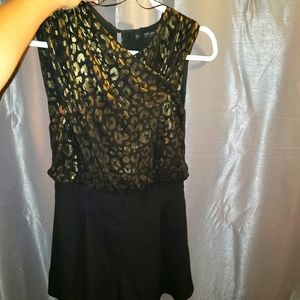 Small zara romper in black and gold.